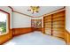 Bright office featuring built in shelves, wood trim, and a ceiling fan at 7641 Kelty Trl, Franktown, CO 80116