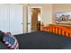 Bedroom with closet and doorway views plus a TV on a wooden dresser at 1168 Coneflower Way, Brighton, CO 80601