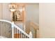 Elegant foyer features a decorative chandelier and charming accents above the entry door at 1168 Coneflower Way, Brighton, CO 80601