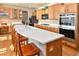 Modern kitchen featuring an island with sink, stainless steel appliances, and breakfast bar at 1168 Coneflower Way, Brighton, CO 80601