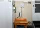 Mud room with a utility sink, wooden shelf and storage, and a white door at 1168 Coneflower Way, Brighton, CO 80601