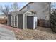 A backyard storage shed providing extra space for storing lawn equipment and outdoor items at 1168 Coneflower Way, Brighton, CO 80601