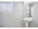 Simple pedestal sink in a small, bright bathroom at 21021 E 63Rd Dr, Aurora, CO 80019