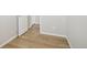 Simple bedroom with light gray walls and wood flooring at 21021 E 63Rd Dr, Aurora, CO 80019