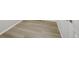 Light brown laminate wood flooring in hallway at 21021 E 63Rd Dr, Aurora, CO 80019