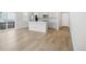 Modern kitchen with light gray cabinets, stainless steel appliances, and an island at 21021 E 63Rd Dr, Aurora, CO 80019