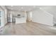 Open concept kitchen with light gray cabinets and stainless steel appliances at 21021 E 63Rd Dr, Aurora, CO 80019