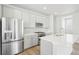 Modern kitchen with stainless steel appliances and light gray cabinets at 21021 E 63Rd Dr, Aurora, CO 80019