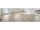 Light and bright living room with neutral tone laminate flooring at 21021 E 63Rd Dr, Aurora, CO 80019