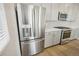 Stainless steel French door refrigerator with ice and water dispenser at 21021 E 63Rd Dr, Aurora, CO 80019