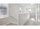 Upstairs hallway with carpet and natural light at 21021 E 63Rd Dr, Aurora, CO 80019