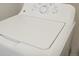 White GE washer with multiple settings at 21021 E 63Rd Dr, Aurora, CO 80019
