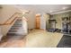 Basement with home gym and stairs at 30174 Glen Eyrie Dr, Evergreen, CO 80439