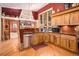 Modern kitchen with wooden cabinets, stainless steel appliances, and granite countertops at 30174 Glen Eyrie Dr, Evergreen, CO 80439