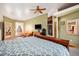 Main bedroom features a king bed and walk-in shower at 30174 Glen Eyrie Dr, Evergreen, CO 80439