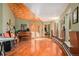 Music room with hardwood floors, piano, and guitars at 30174 Glen Eyrie Dr, Evergreen, CO 80439