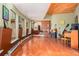 Music room with hardwood floors, piano, and guitars at 30174 Glen Eyrie Dr, Evergreen, CO 80439