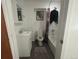 Bathroom with a tub, toilet, sink, and dark tile floors at 4824 S Eaton Park Way, Aurora, CO 80016