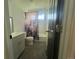 Well-lit bathroom featuring a shower-tub combo, a sink, and a colorful patterned curtain at 4824 S Eaton Park Way, Aurora, CO 80016