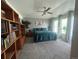 Spacious bedroom with neutral walls, soft carpet, a ceiling fan, and a bright, airy feel at 4824 S Eaton Park Way, Aurora, CO 80016