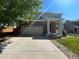 Two story home with a two car garage and a covered front porch at 4824 S Eaton Park Way, Aurora, CO 80016