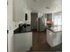 Bright kitchen with stainless steel appliances and white cabinetry at 4824 S Eaton Park Way, Aurora, CO 80016