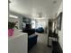 Living room with blue sofas, gray walls, and a large flat screen TV at 4824 S Eaton Park Way, Aurora, CO 80016