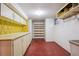 Unfinished basement with storage cabinets and shelves at 6587 S Clarkson St, Centennial, CO 80121