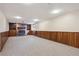 Spacious finished basement with brick fireplace and built-in shelving at 6587 S Clarkson St, Centennial, CO 80121
