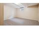 Finished basement with neutral carpet, and access to a window at 6587 S Clarkson St, Centennial, CO 80121