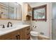 Updated bathroom features modern fixtures, vanity with drawers and a framed mirror at 6587 S Clarkson St, Centennial, CO 80121