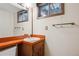 Bathroom with vanity, a large mirror, and a window at 6587 S Clarkson St, Centennial, CO 80121