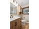 Bathroom features modern fixtures, vanity with drawers and a framed mirror at 6587 S Clarkson St, Centennial, CO 80121