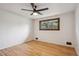 Bedroom with hardwood floors, ceiling fan, light and bright with large window at 6587 S Clarkson St, Centennial, CO 80121