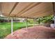 Covered patio with stone flooring and view of the green lawn at 6587 S Clarkson St, Centennial, CO 80121