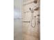 Large tiled shower with glass door, dual shower heads and grab bar at 6587 S Clarkson St, Centennial, CO 80121