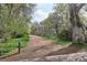 Tranquil walking path surrounded by mature trees and lush greenery, great for outdoor activities at 6587 S Clarkson St, Centennial, CO 80121