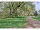 Scenic walking path surrounded by mature trees and lush greenery, perfect for enjoying the outdoors at 6587 S Clarkson St, Centennial, CO 80121