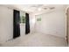 A bedroom with carpet, a ceiling fan, and natural light from two windows at 3065 Zion St, Aurora, CO 80011