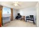 A bedroom featuring carpeted floors, a ceiling fan, and a view from a window at 3065 Zion St, Aurora, CO 80011
