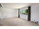Bright bedroom with neutral carpet, a large window, and ample closet space at 3065 Zion St, Aurora, CO 80011