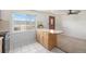 Bright kitchen featuring wood breakfast bar and a large window with backyard views at 3065 Zion St, Aurora, CO 80011