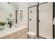 Clean bathroom with frameless shower, modern vanity, and sleek black fixtures at 1101 S Dahlia St, Denver, CO 80246