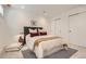 Cozy bedroom with a plush bed, sliding closet doors, and comfortable decor at 1101 S Dahlia St, Denver, CO 80246