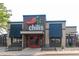 Chili's storefront with brick accents, dark blue awnings, and an inviting red door at 1101 S Dahlia St, Denver, CO 80246
