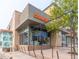 Dunkin storefront with glass windows under an awning with a well-lit sign visible at 1101 S Dahlia St, Denver, CO 80246