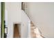 Bright entryway featuring a staircase, light wood floors, and access to the basement at 1101 S Dahlia St, Denver, CO 80246