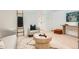 Cozy living room features stylish decor, modern lighting, and a comfortable armchair at 1101 S Dahlia St, Denver, CO 80246