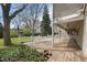 Covered wooden deck with seating, views of the backyard and access to the main house at 3821 S Magnolia Way, Denver, CO 80237