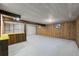 Spacious basement with carpet, wooden support beam and cabinets for ample storage at 3821 S Magnolia Way, Denver, CO 80237